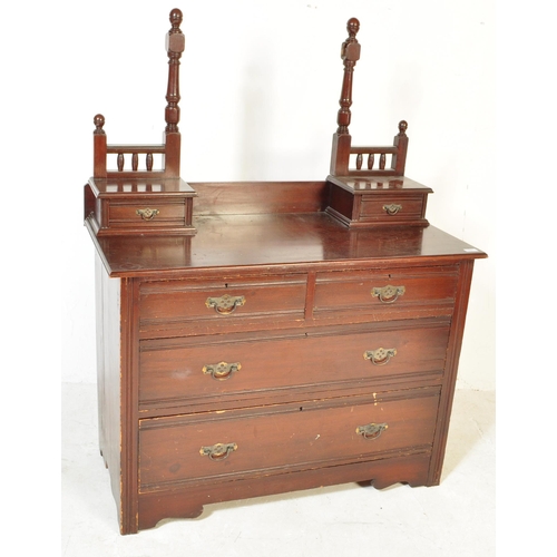 1553 - An Edwardian mahogany chest of drawers. Raised on plinth base with short and deep drawers having swi... 