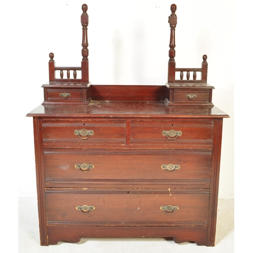 1553 - An Edwardian mahogany chest of drawers. Raised on plinth base with short and deep drawers having swi... 