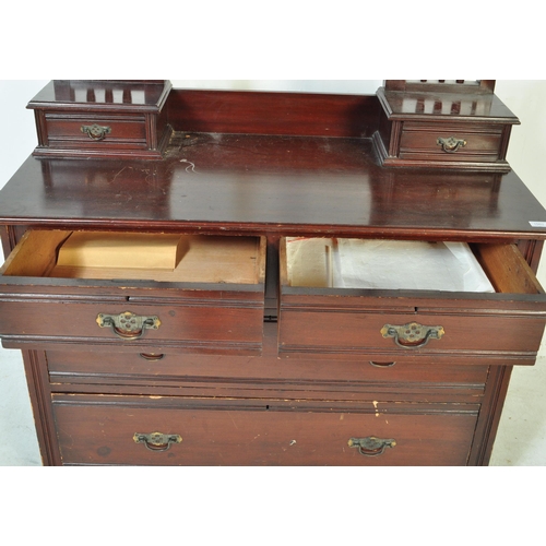 1553 - An Edwardian mahogany chest of drawers. Raised on plinth base with short and deep drawers having swi... 