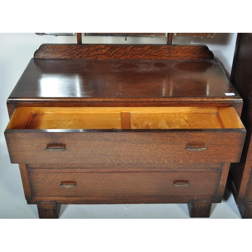 1554 - A 1930's Art Deco oak dressing table - chest being raised on bracket feet  with a low and wide body ... 