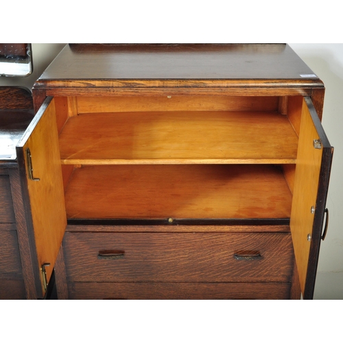 1554 - A 1930's Art Deco oak dressing table - chest being raised on bracket feet  with a low and wide body ... 