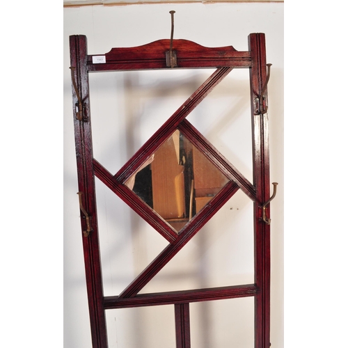 1563 - A Victorian 19th century mahogany hallstand. The Hall stand with reeded decoration to the uprights, ... 