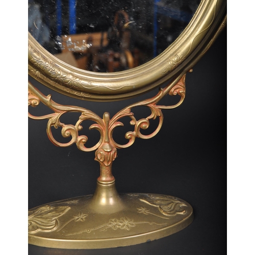 1565 - A large early 20th century Art Nouveau style brass table top dressing table swing mirror. The mirror... 