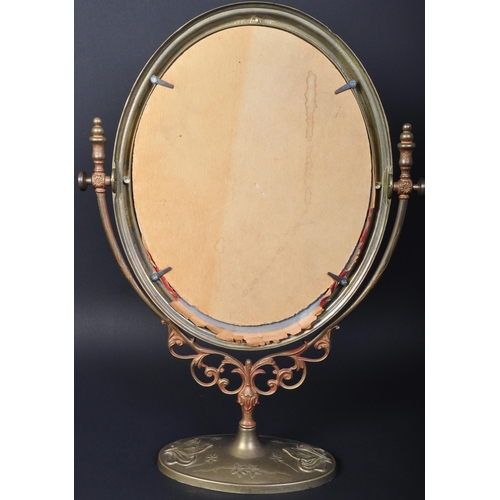 1565 - A large early 20th century Art Nouveau style brass table top dressing table swing mirror. The mirror... 