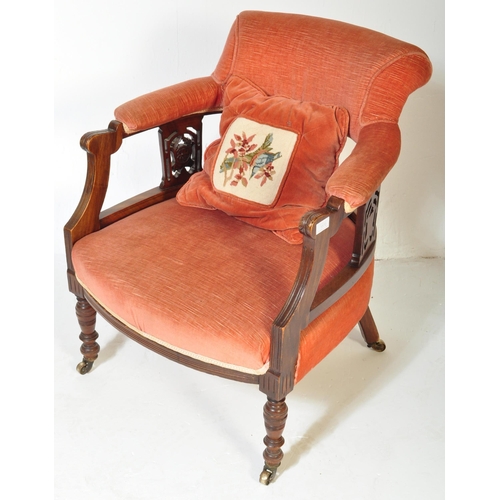 1570 - A 19th century Victorian mahogany tub armchair. Raised on turned legs with overstuffed seat and back... 