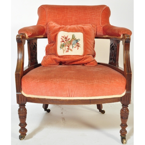 1570 - A 19th century Victorian mahogany tub armchair. Raised on turned legs with overstuffed seat and back... 