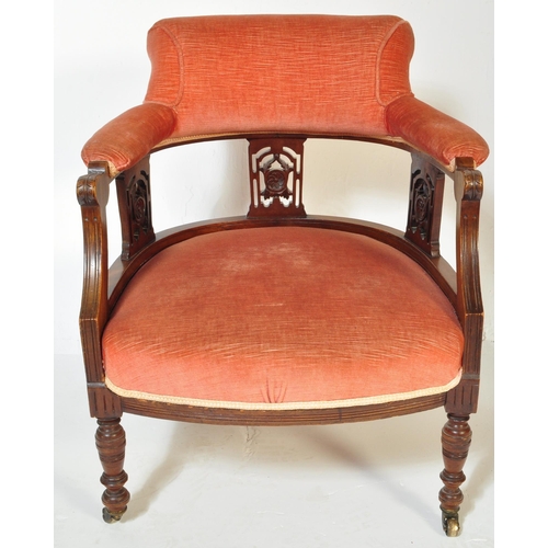 1570 - A 19th century Victorian mahogany tub armchair. Raised on turned legs with overstuffed seat and back... 