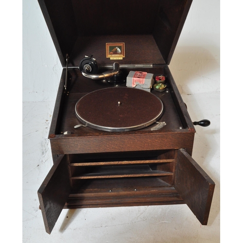 1571 - A 1920's early 20th century oak cased table top gramophone by HMV - His Masters Voice. Hinged top wi... 