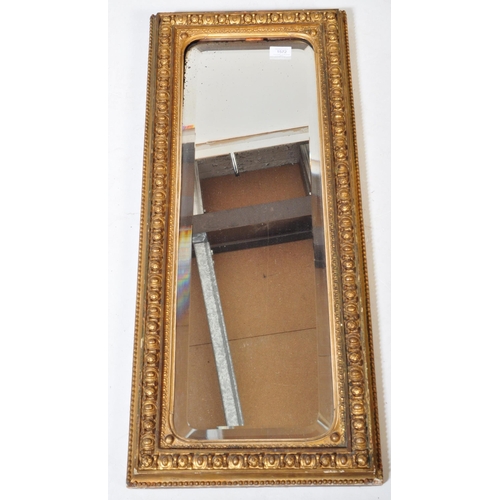 1572 - 19th century Victorian gilt wood and gesso worked bevel edge rectangular wall mirror. The central mi... 