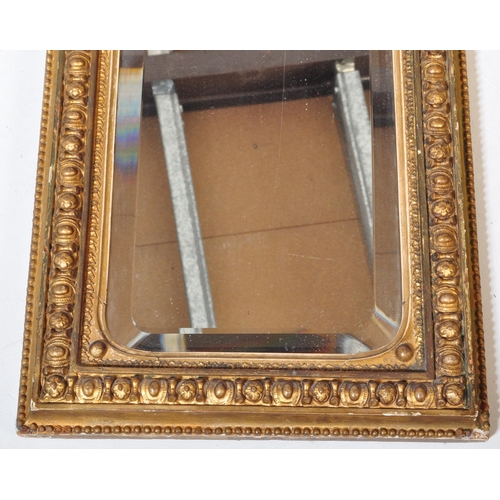 1572 - 19th century Victorian gilt wood and gesso worked bevel edge rectangular wall mirror. The central mi... 