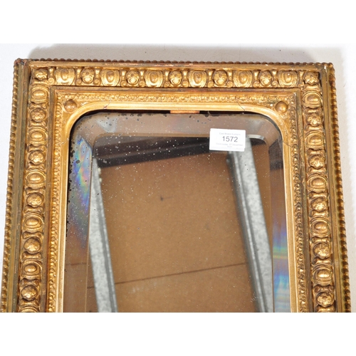 1572 - 19th century Victorian gilt wood and gesso worked bevel edge rectangular wall mirror. The central mi... 