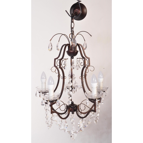 1574 - 20th century cut glass and wrought metal classical 5 arm chandelier. The shaped wrought metal frame ... 