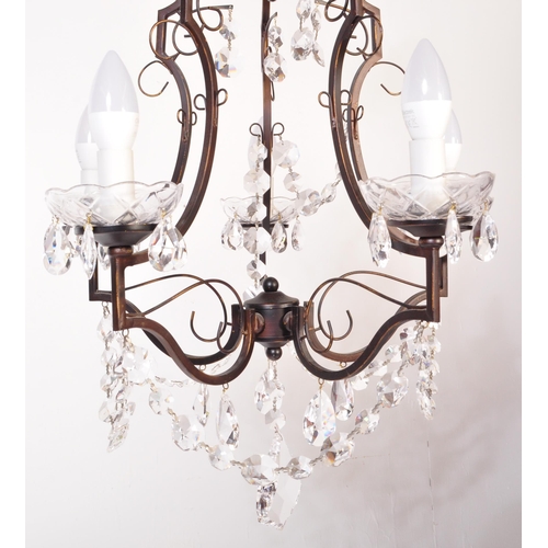 1574 - 20th century cut glass and wrought metal classical 5 arm chandelier. The shaped wrought metal frame ... 