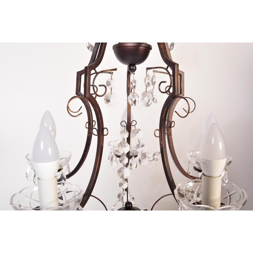 1574 - 20th century cut glass and wrought metal classical 5 arm chandelier. The shaped wrought metal frame ... 