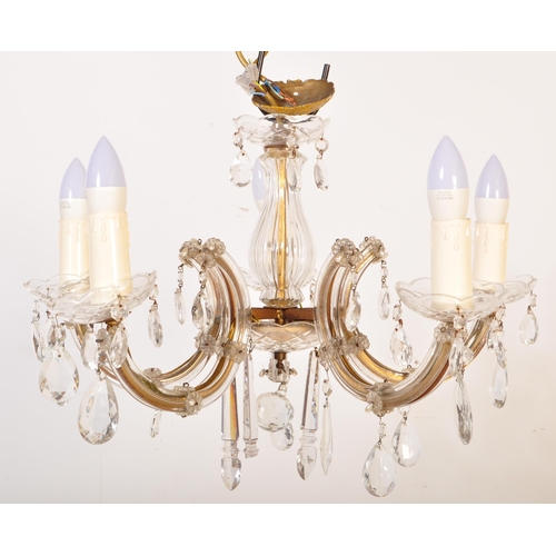 1575 - A 20th century cut glass and gilt metal classical 5 arm chandelier. The shaped gilt metal frame set ... 