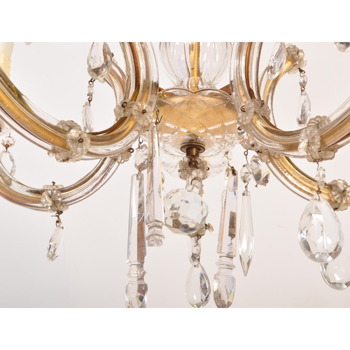 1575 - A 20th century cut glass and gilt metal classical 5 arm chandelier. The shaped gilt metal frame set ... 