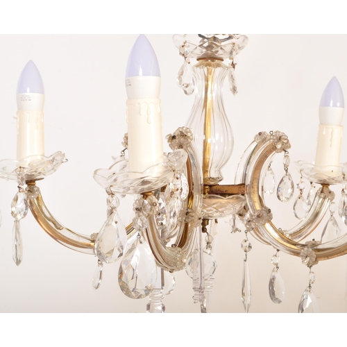 1575 - A 20th century cut glass and gilt metal classical 5 arm chandelier. The shaped gilt metal frame set ... 