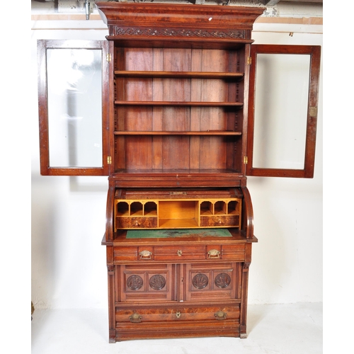 1579 - A late 19th Century Aesthetic movement mahogany cylinder bureau bookcase. Having a flared top with r... 