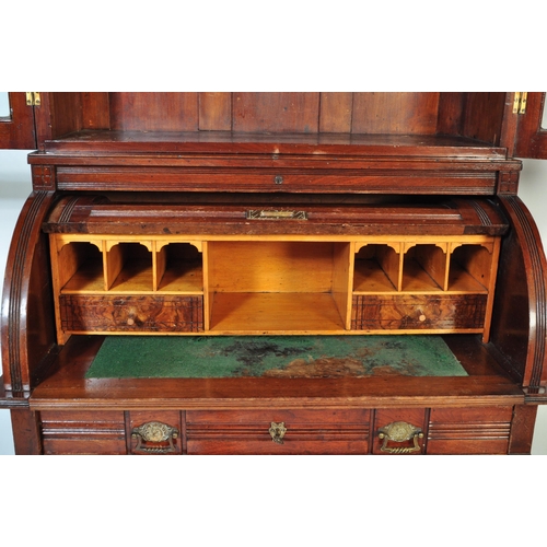 1579 - A late 19th Century Aesthetic movement mahogany cylinder bureau bookcase. Having a flared top with r... 