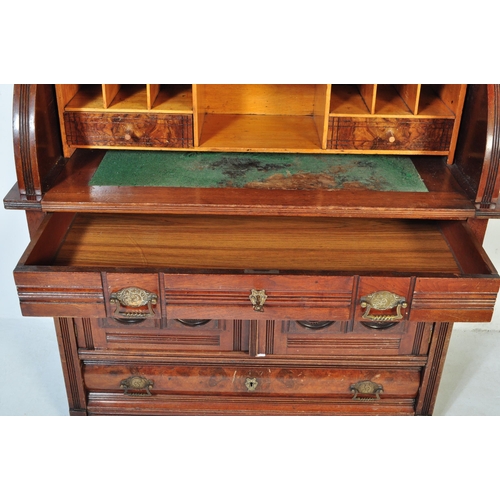 1579 - A late 19th Century Aesthetic movement mahogany cylinder bureau bookcase. Having a flared top with r... 