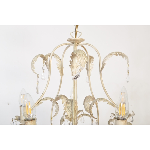 1581 - A 20th century painted metal Tollware five arms chandelier. The chandelier being painted white havin... 