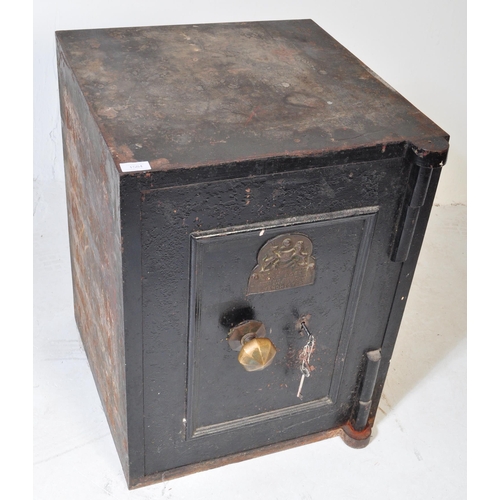 1584 - A Victorian late 19th century John Port of Manchester black cast iron safe with key. The safe having... 