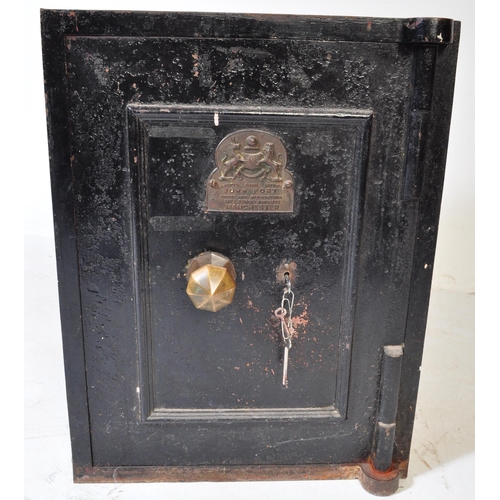 1584 - A Victorian late 19th century John Port of Manchester black cast iron safe with key. The safe having... 