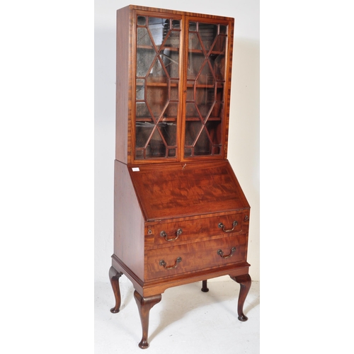 1608 - A 1930's Queen Anne revival walnut and burr walnut bureau bookcase. Of rectangular form with twin gl... 