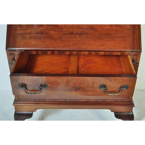 1608 - A 1930's Queen Anne revival walnut and burr walnut bureau bookcase. Of rectangular form with twin gl... 