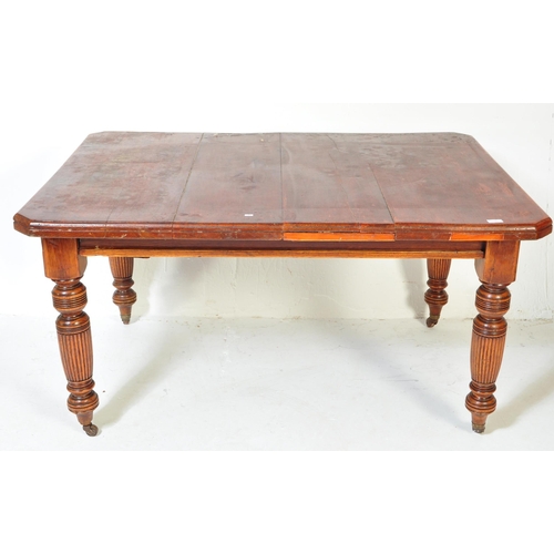 1609 - A19th Century Victorian mahogany dining table. Of rectangular form with chunky turned legs terminati... 