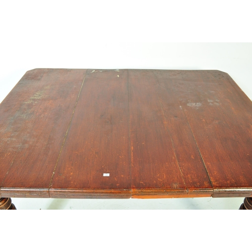 1609 - A19th Century Victorian mahogany dining table. Of rectangular form with chunky turned legs terminati... 