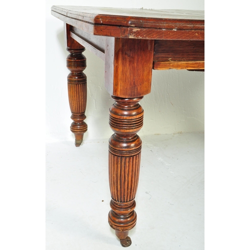 1609 - A19th Century Victorian mahogany dining table. Of rectangular form with chunky turned legs terminati... 