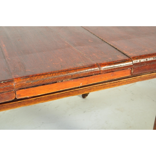 1609 - A19th Century Victorian mahogany dining table. Of rectangular form with chunky turned legs terminati... 