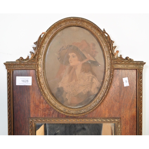 1628 - An early 20th Century wall hanging mirror. With gilt and rosewood border, portrait decoration to top... 