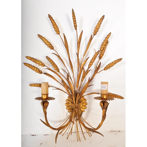 1632 - A pair of mid 20th century circa 1950s gilt metal wall shaped lights. Each lamp being shaped in the ... 