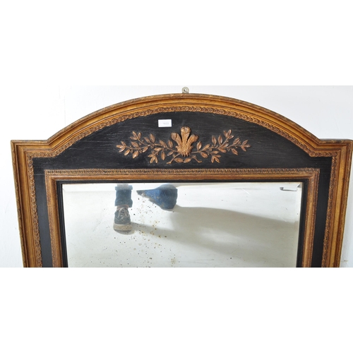 1633 - A Victorian 19th century ebonised & gilt wooden overmantel mirror. The mirror having an arched top w... 