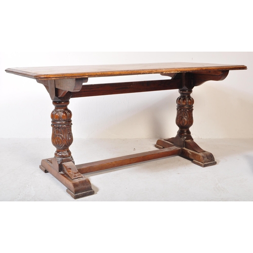 1637 - A Jacobean revival carved oak refectory dining table. The table raised on heavily carved baluster le... 