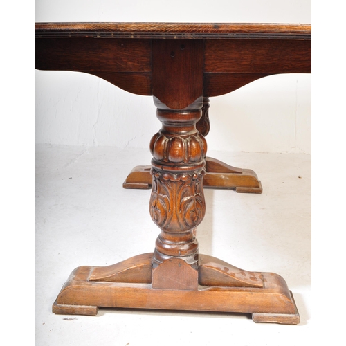 1637 - A Jacobean revival carved oak refectory dining table. The table raised on heavily carved baluster le... 