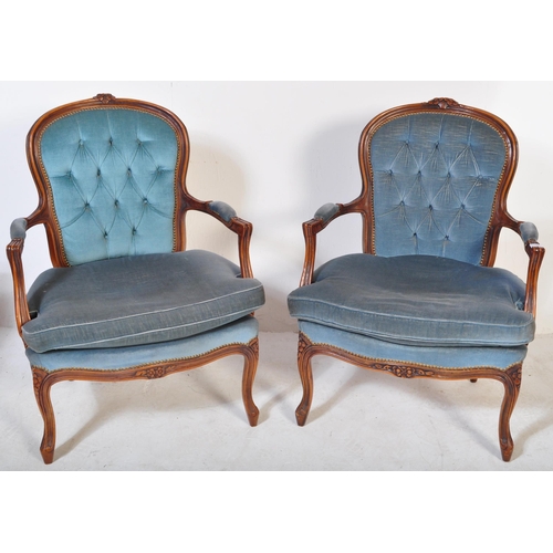 1646 - A pair of 20th century French Louis XV fauteuil armchairs / lounge chairs having carved show wood fr... 