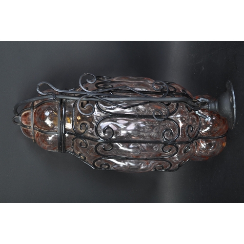 1652 - A 20th century hand blown glass & metal wire ceiling porch light. The lamp having pink glass. The la... 