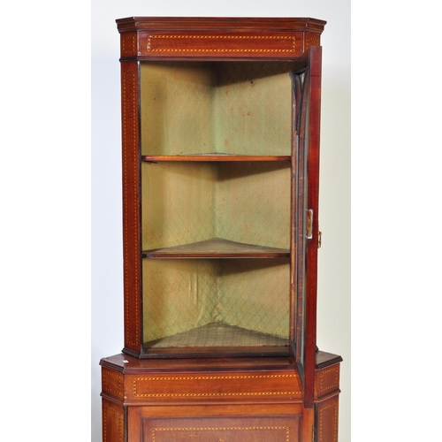 1654 - A 19th century George III mahogany and line inlaid corner cabinet. Raised on bracket feet with inlai... 