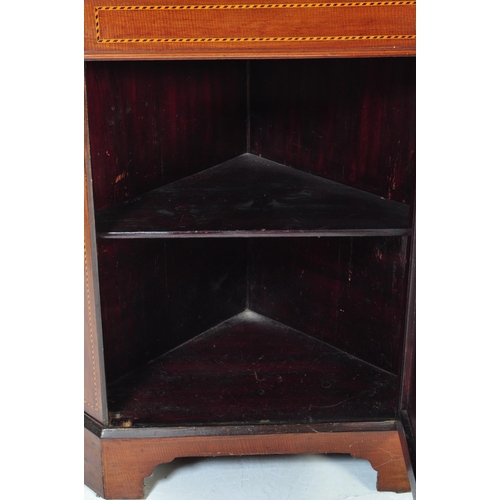 1654 - A 19th century George III mahogany and line inlaid corner cabinet. Raised on bracket feet with inlai... 