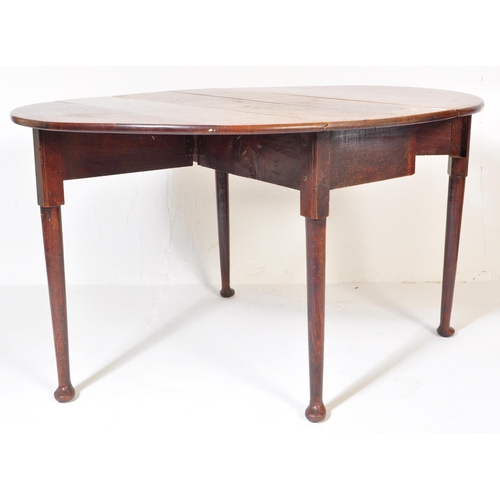 1655 - 18th century George III solid oak drop leaf pad foot dining table. Raised on turned tapering legs wi... 