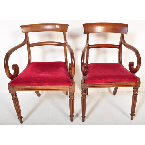 1657 - A pair of 19th century Regency mahogany bar back carver dining armchair. Raised on reeded tapering l... 