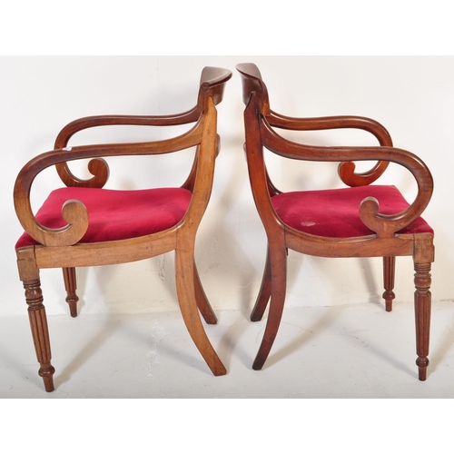 1657 - A pair of 19th century Regency mahogany bar back carver dining armchair. Raised on reeded tapering l... 