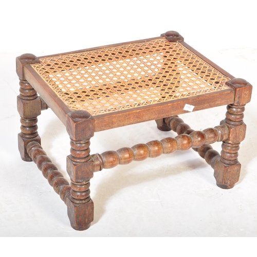 1658 - 1920's mahogany and cane worked foot stool in the William & Mary revival manner. Block and turned le... 