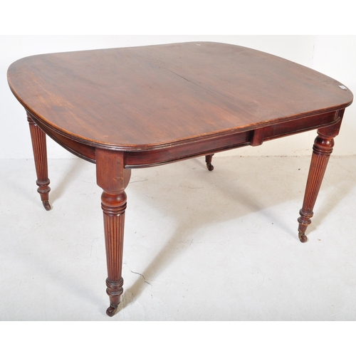 1659 - A 19th century, circa 1850 mahogany dining table. Raised on tapering legs with reeded bulbous column... 