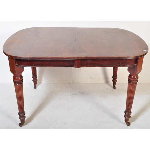 1659 - A 19th century, circa 1850 mahogany dining table. Raised on tapering legs with reeded bulbous column... 