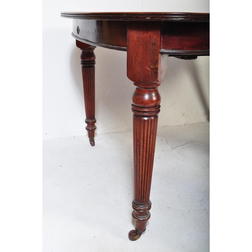 1659 - A 19th century, circa 1850 mahogany dining table. Raised on tapering legs with reeded bulbous column... 