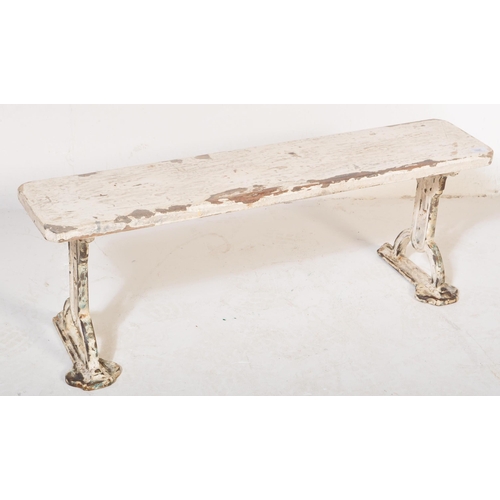 1686 - A Victorian 19th century cast iron & wood painted bench. The bench having painted white cast iron pi... 